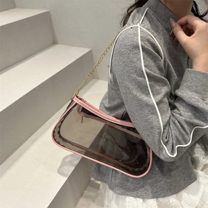 Minimalist transparent grey shoulder bag with pink leather trim and gold chain strap