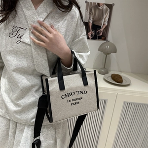 Large beige canvas tote bag with black trim and Paris print for stylish women's daily commute