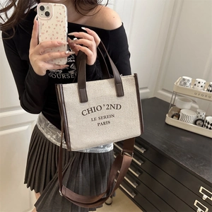 Large canvas and leather tote bag with wide shoulder strap for women daily commuting