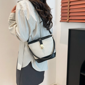 Minimalist bicolor bucket bag with grey woven texture and black leather trim for women