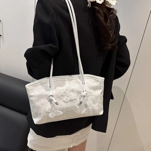 White lace tote bag with 3D butterfly floral embroidery styled on a model shoulder
