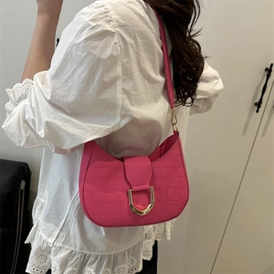 Pink crocodile pattern crescent shoulder bag with golden D-ring buckle detail