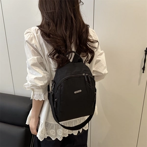 Chic black nylon backpack for women, stylish minimalist large capacity commuter daypack
