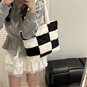 Chic black and white checkerboard plush tote bag with soft shoulder strap for women