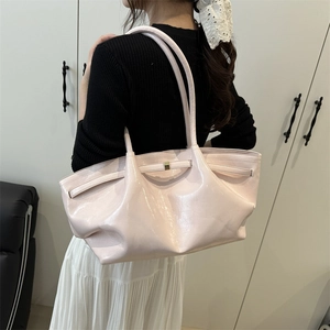 Pale pink glossy pleated tote bag with golden metal hardware for minimalist daily commute