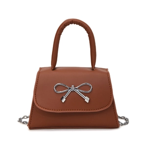 Brown faux leather square handbag with silver bow detail and thick handle in front view