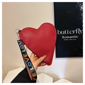 Detail of red heart-shaped clutch bag in lychee leather with colorful LOVE wrist strap