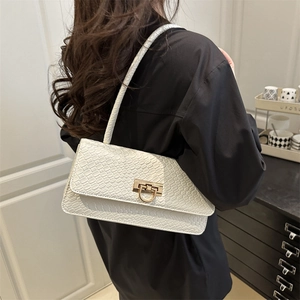 Chic white baguette shoulder bag with crocodile pattern and golden horseshoe buckle