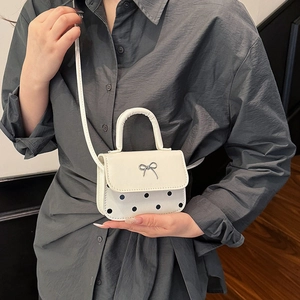 Chic white mini square bag with black polka dots and silver metal bow decoration
