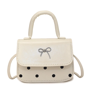 Chic women's mini white handbag with black polka dots and silver bow decoration