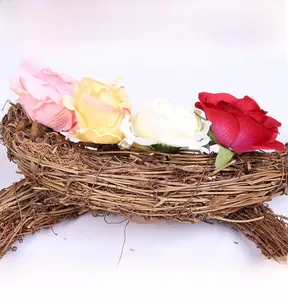 Macro detail of Easter moon wreath with handmade faux roses and natural rattan base