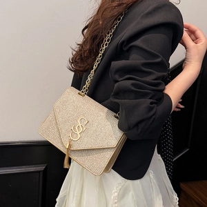 Sparkling champagne gold glitter crossbody bag with tassel and gold chain strap