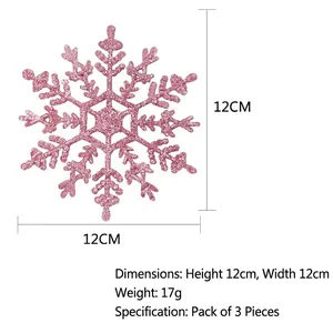 Detail of 12cm pink glitter snowflake ornament showing size markings and sparkly texture