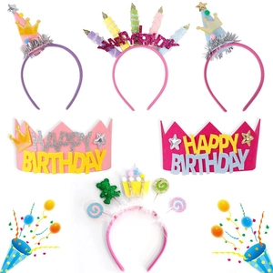 Various colorful birthday party headbands including glitter crowns and bear motifs