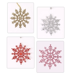 Detail of 12cm plastic glitter snowflake ornaments in gold, silver, red, and pink colors