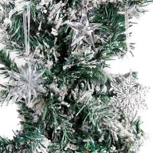 Clear acrylic Christmas tree ornaments featuring snowflake and star shapes on pine branches