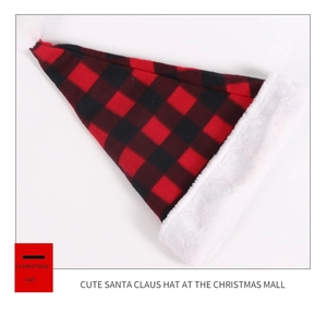 Detail of red and black buffalo plaid Christmas hat with white plush faux fur trim
