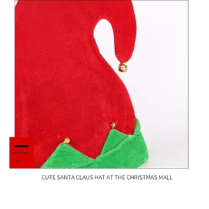 Detail of soft velvet Christmas elf hat featuring red and green stitching with gold bells