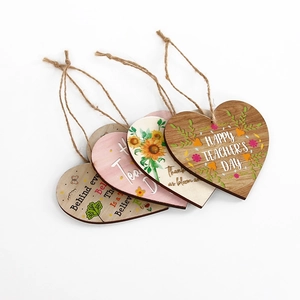 Set of four heart-shaped wooden plaques for Teacher's Day with sunflower and floral prints