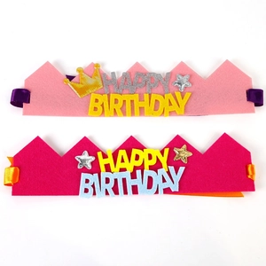Detail showing two felt birthday crown headbands with colorful felt letters and satin ribbons