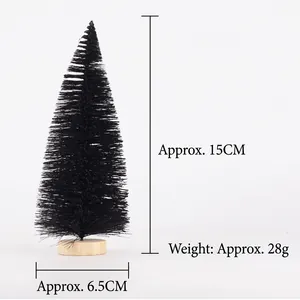 Close-up of black mini Christmas tree with a round wooden base and modern frosted design