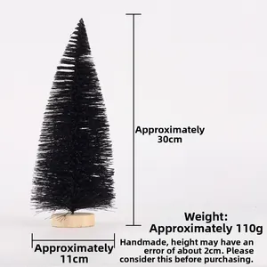 Detail view of a 30cm black mini Christmas tree with a round wooden base and needle texture