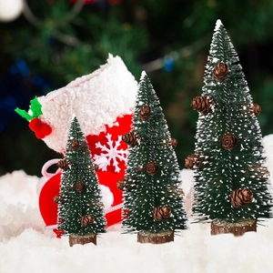 Three-piece frosted mini Christmas trees with pine cones on natural wood bases