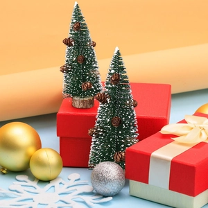 Mini frosted sisal Christmas trees with pine cones on rustic wood bases for holiday decor