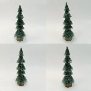Detailed view of four mini green sisal Christmas trees with snow effect and wooden bases