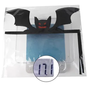 Detail shot of a black felt bat wall sticker on a digital scale showing 17.1g weight