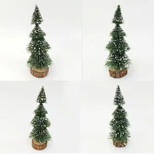 Mini artificial green cedar Christmas tree with white snow coating and natural wooden base