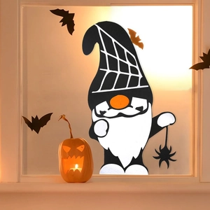 Detailed Halloween gnome window decal with spider web hat and glowing pumpkin backdrop
