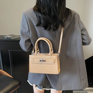 Women's apricot crocodile pattern handbag with top handle and shoulder strap