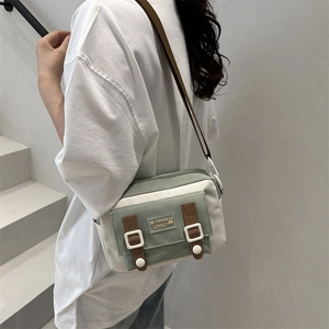 Fashionable contrast canvas crossbody bag in green and white with rabbit patch