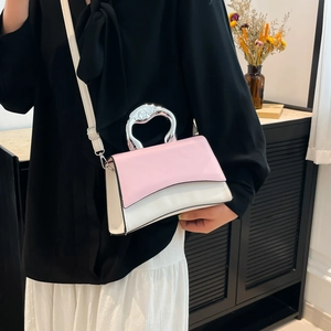 Pink and white square crossbody bag with artistic silver handle and slim shoulder strap