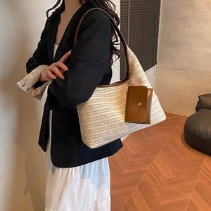 Large capacity woven straw tote bag with brown leather straps and small pouch