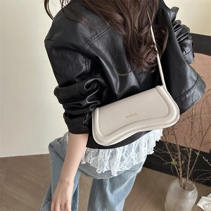 Minimalist white leather baguette shoulder bag with XM & BAGS logo for modern women