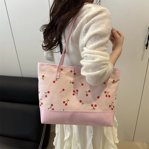Pink canvas tote bag with red cherry patterns and durable PU leather bottom base