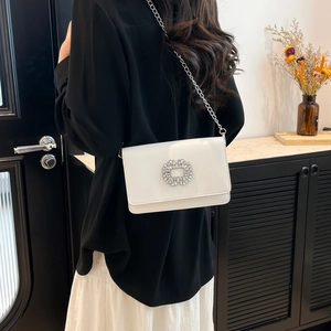 Elegant white rectangular flap bag with rhinestone buckle and silver chain strap