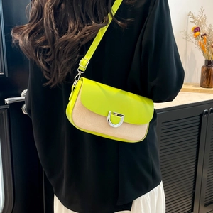 Fashionable crossbody bag with neon green leather flap and beige woven texture details