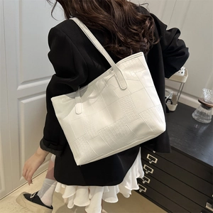 White faux leather tote bag with elegant crocodile texture patchwork and slim shoulder straps