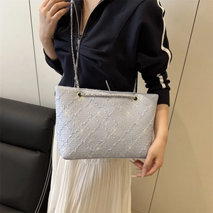 Fashionable light blue embroidered floral tote bag with elegant gold chain strap for women