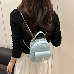 Light blue quilted mini backpack with diamond pattern and silver chain strap for women