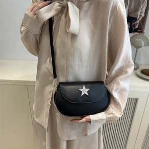 Fashionable black crossbody bag with a silver rhinestone star on high-quality faux leather