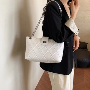 Chic white quilted crossbody bag with diamond stitching and metal chain strap for women