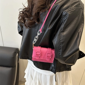 Elegant rose pink mini square crossbody bag with textured leather and acrylic chain strap