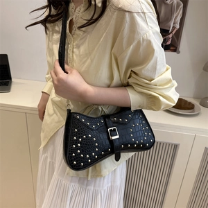 Black crocodile pattern baguette bag with gold studs and metal buckle shoulder strap