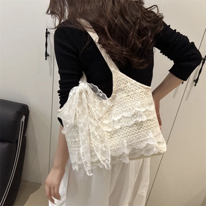 Chic cream lace shoulder bag with tiered ruffles and large bow decoration for women