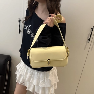 French style creamy yellow shoulder bag with wide strap and golden metal buckle