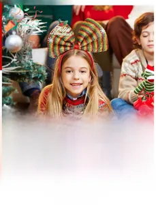 Macro detail of Christmas headband featuring glitter striped bow and Feliz Navidad text